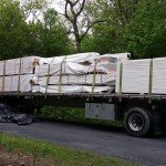 tractor trailer truck delivering log home, Timberhaven, delivery day, log homes, log cabin, custom built log home, laminated, kiln-dried