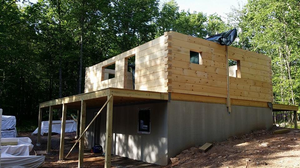 log home under construction, Timberhaven, custom built log home, kiln dried, home builder, Timberhaven, laminated