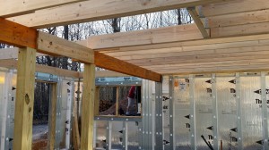 support posts and decking for basement, custom built log home, Timberhaven, kiln dried, laminated, log cabins