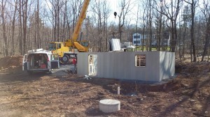 crane used to set superior wall basement, custom built log home, Timberhaven, kiln dried, laminated, log cabins