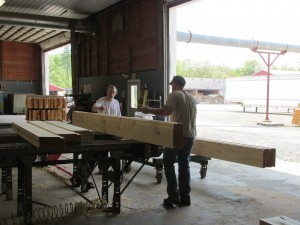 log being inspected, Log Homes Council grading standards, Timberhaven, custom built log home, log homes, log cabin, kiln-dried