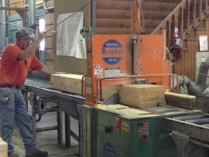 laminated log being pre-cut to exact length, Timberhaven Log Homes, custom built log home, kiln-dried