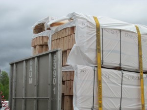 strapping down the log packs, Timberhaven, delivery day, log homes, log cabin, custom built log home, laminated, kiln-dried