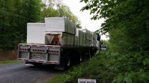 truck of log home materials to be unloaded, Timberhaven, delivery day, log homes, log cabin, custom built log home, laminated, kiln-dried