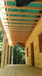 lower side of porch ceiling, log home under construction, custom built log home, Timberhaven, kiln dried, laminated, heavy timbered system