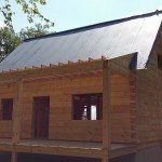 felt paper over T&G, beam & purlin roof, log home under construction, custom built log home, Timberhaven, kiln dried, laminated