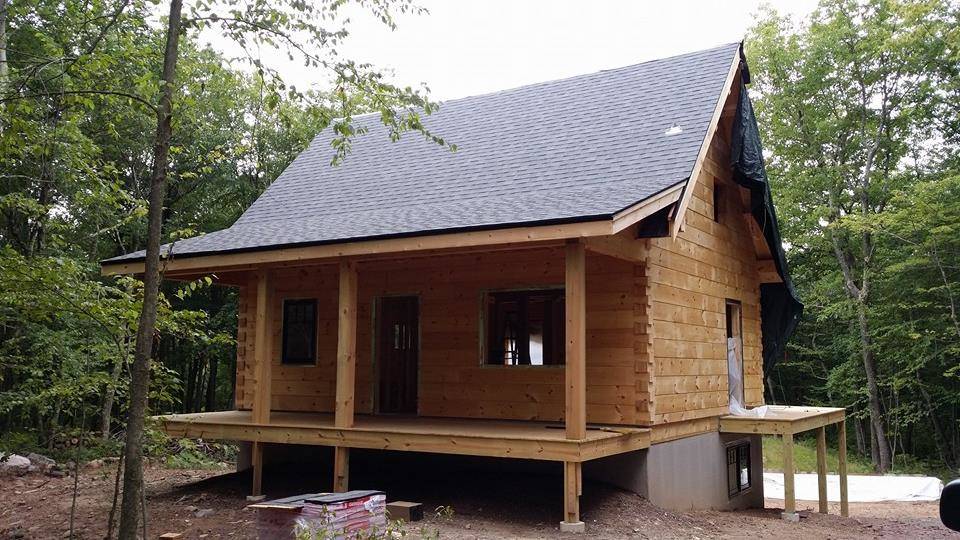 shingles on newly constructed roof, beam & purlin roof system, custom built log home, weather-tight package, laminated, kiln-dried, Timberhaven Log Homes