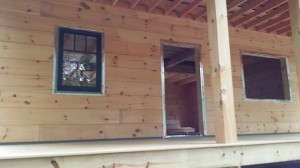 windows and doors being prepped for installation, log home under construction, weather-tight phase, kiln-dried, laminated, Timberhaven