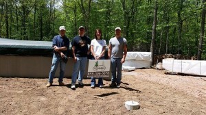 customers with local rep and owner of Timberhaven Log Homes, log homes, custom built log home, under construction, customer support, planning log home, laminated, kiln dried