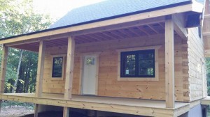 final trim on front door and windows, log home construction progress, Timberhaven, custom built log home, laminated, kiln dried