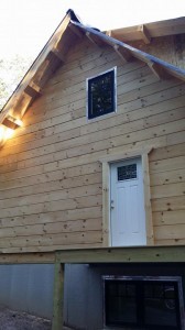 side of log hoome under construction, log home construction progress, Timberhaven, custom built log home, laminated, kiln dried