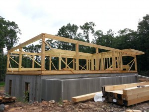 first floor framing, post and beam home, under construction, log homes, log cabins, log cabin kits, Timberhaven, post and beam cabin, post and beam cabin kits, kiln dried, laminated