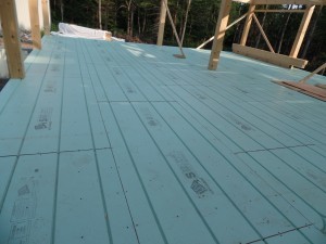 Warmboard in place on subfloor, in-floor radiant heat, post and beam construction, under construction, log homes, log cabins, log cabin kits, Timberhaven, post and beam cabin, post and beam cabin kits, kiln dried, laminated