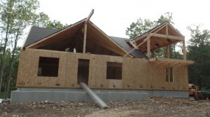 first floor SIPs installed to custom post and beam home, post and beam homes, under construction, log homes, log cabin, log cabin kits, Timberhaven Log Homes, laminated, kiln dried, heavy timbers, SIPs