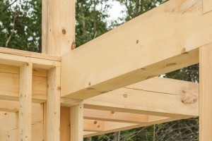 beam pocket in conventionally framed wall, post and beam home under construction, Timberhaven, log home, log homes, log cabin, laminated, kiln dried
