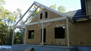 post and beam porch under construction on post and beam home, compound cuts, White Pine, post and beam porch, under construction, solid wood home, log homes, log cabins, log cabin kit, Pennsylvania home, Timberhaven, laminated, kiln dried