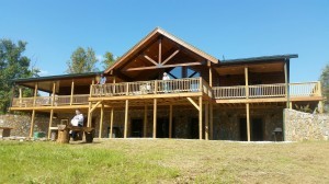 rear porch and deck of custom log home, Timberhaven log home in Ararat, VA, JB Kerns wounded warrier project, honored to support, Timberhaven Log Homes, log home, log cabin, log cabins, log kits, laminated, kiln dried