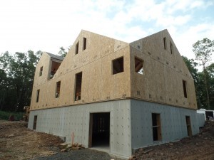 two-story post and beam home, second floor installation of SIPs of custom post and beam home construction, post and beam homes, post and beam home design, Timberhaven Log Homes, log homes, log home, log cabins, log cabin kits, laminated, kiln dried, under construction