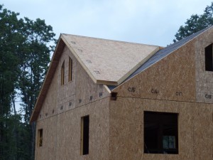 two-story post and beam home, pre-cut valley and peak on roof SIPs, custom post and beam home construction, post and beam homes, post and beam home design, Timberhaven Log Homes, log homes, log home, log cabins, log cabin kits, laminated, kiln dried, under construction