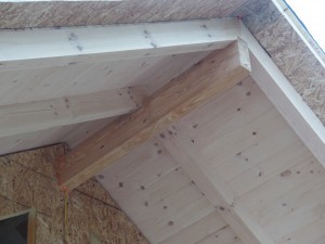 glu-lam and rafters and tongue and groove on porch of post and beam home, compound cuts, White Pine, post and beam porch, under construction, solid wood home, log homes, log cabins, log cabin kit, Pennsylvania home, Timberhaven, laminated, kiln dried