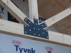 King Post Truss and closeup of gusset plate on porch of post and beam home, post and beam porch, under construction, solid wood home, log homes, log cabins, log cabin kit, Pennsylvania home, Timberhaven, laminated, kiln dried