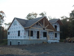 exterior post and beam home under construction, post and beam wood home, custom design, dream home, log homes, log cabin homes, log cabin kits, log cabins, Timberhaven Log Homes, laminated, kiln dried