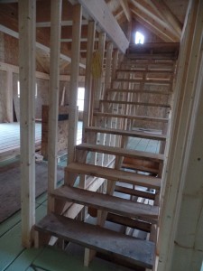 stairs from first to second level, post and beam house, laminated logs, heavy timbers, Timberhaven, log homes, log cabin kits, kiln dried