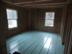 Warmboard in-floor radiant heating in bedroom, PEX installation, post and beam wood home, custom design, dream home, log homes, log cabin homes, log cabin kits, log cabins, Timberhaven Log Homes, laminated, kiln dried