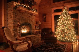 roaring fire in holiday themed log home, timberhaven log homes, log homes, log cabin kits, log cabins, Merry Christmas, stone fireplace