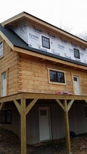 housewrap on shed dormer of log cabin home, log cabin, log cabin homes, log homes, log cabin kits, Timberhaven, under construction, post and beam, laminated, kiln dried, PA manufacturer