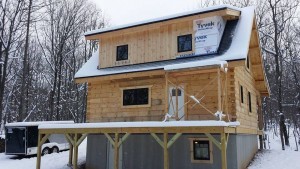 board & batten being installed to shed dormer, log cabin, log cabin homes, log homes, log cabin kits, Timberhaven, under construction, post and beam, laminated, kiln dried, PA manufacturer