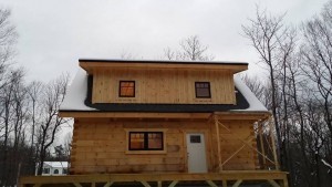 completed shed dormer with board and batten, log cabin, log cabin homes, log homes, log cabin kits, Timberhaven, under construction, post and beam, laminated, kiln dried, PA manufacturer