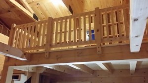 white pine railing on 2nd floor loft, log cabin, log homes, log cabin homes, Timberhaven, under construction, laminated, kiln dried, Pennsylvania manufacturer