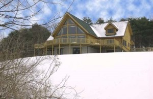 custom log home in snowy wooded setting, prow front design, humidity levels, Timberhaven Log Homes, log homes, log cabin homes, log cabins, post and beam homes, timberframe homes, timber frame homes, laminated logs, engineered logs, floor plan designs, kiln dried logs