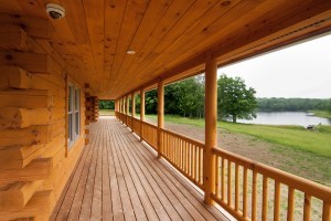 beautiful front porch with round railing, Timberhaven Log Homes, log homes, log cabins, log cabin homes, laminated logs, kiln dried logs, engineered logs, kiln-dried laminated logs, post and beam home, timber frame, Pennsylvania