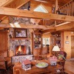 main living area of custom log home with fireplace and cathedral ceiling, cape cod design, humidity levels, Timberhaven Log Homes, log homes, log cabin homes, log cabins, post and beam homes, timberframe homes, timber frame homes, laminated logs, engineered logs, floor plan designs, kiln dried logs