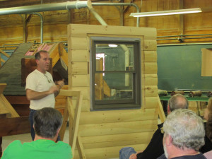 expert showing how to install a window in a log home, log home builders, Timberhaven Log Homes, log homes, log cabin homes, log cabins, post and beam homes, timberframe homes, timber frame homes, laminated logs, engineered logs, floor plan designs, kiln dried logs