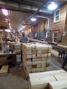 log ends being bundled for log home, Timberhaven Log Homes, log homes, log cabin homes, log cabins, post and beam homes, timberframe homes, timber frame homes, laminated logs, engineered logs, floor plan designs, kiln dried logs, nature friendly