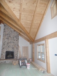 interior wall with drywall and fireplace, post and beam home, interior finishes, Timberhaven Log Homes, log homes, log cabin homes, log cabins, post and beam homes, timberframe homes, timber frame homes, laminated logs, engineered logs, floor plan designs, kiln dried logs