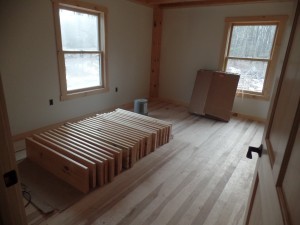 Hickory hardwood flooring in bedroom, post and beam home, interior finishes, Timberhaven Log Homes, log homes, log cabin homes, log cabins, post and beam homes, timberframe homes, timber frame homes, laminated logs, engineered logs, floor plan designs, kiln dried logs