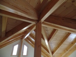 varied roof lines intersect at vertical post, post and beam home, interior finishes, Timberhaven Log Homes, log homes, log cabin homes, log cabins, post and beam homes, timberframe homes, timber frame homes, laminated logs, engineered logs, floor plan designs, kiln dried logs