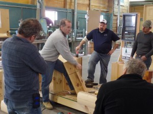 expert demonstrating log home construction practices, log home builders, Timberhaven Log Homes, log homes, log cabin homes, log cabins, post and beam homes, timberframe homes, timber frame homes, laminated logs, engineered logs, floor plan designs, kiln dried logs