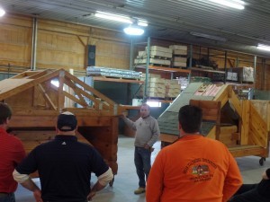 expert demonstrating roof system construction, log home builders, Timberhaven Log Homes, log homes, log cabin homes, log cabins, post and beam homes, timberframe homes, timber frame homes, laminated logs, engineered logs, floor plan designs, kiln dried logs