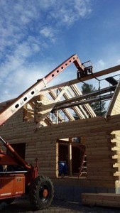 ridge beam being installed on custom log home, 2x12 rafter roof, Timberhaven Log Homes, log homes, log cabin homes, log cabins, post and beam homes, timberframe homes, timber frame homes, laminated logs, engineered logs, floor plan designs, kiln dried logs, Flury Builders, Joe Walsh, Timberhaven local reps, log homes in Massachusetts, log homes in Rhode Island, MA, RI, log home builders