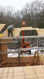 builders stacking gable end logs, two story log home construction, solid log gables, Timberhaven Log Homes, log homes, log cabin homes, log cabins, post and beam homes, timberframe homes, timber frame homes, laminated logs, engineered logs, floor plan designs, kiln dried logs, Flury Builders, Joe Walsh, Timberhaven local reps, log homes in Massachusetts, log homes in Rhode Island, MA, RI, log home builders