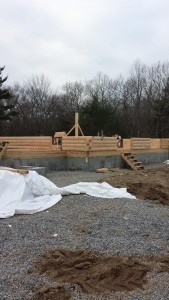 three courses of logs laid for custom log home, log home under construction, Timberhaven Log Homes, log homes, log cabin homes, log cabins, post and beam homes, timberframe homes, timber frame homes, laminated logs, engineered logs, floor plan designs, kiln dried logs, Flury Builders, Joe Walsh, Timberhaven local reps, log homes in Massachusetts, log homes in Rhode Island, MA, RI, log home builders