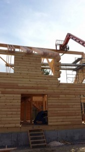 2x12 rafters being installed on custom log home, 2x12 rafter roof, Timberhaven Log Homes, log homes, log cabin homes, log cabins, post and beam homes, timberframe homes, timber frame homes, laminated logs, engineered logs, floor plan designs, kiln dried logs, Flury Builders, Joe Walsh, Timberhaven local reps, log homes in Massachusetts, log homes in Rhode Island, MA, RI, log home builders