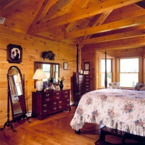 beautiful bedroom in log home, Timberhaven Log Homes, log homes, log cabin homes, log cabins, post and beam homes, timberframe homes, timber frame homes, laminated logs, engineered logs, floor plan designs, kiln dried logs, Flury Builders, Joe Walsh, Timberhaven local reps, log homes in Massachusetts, log homes in Rhode Island, MA, RI, log home builders, 2x12 rafter roof system