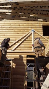 trusses being installed for breezeway roof, solid log breezeway, Log Homes, log homes, log cabin homes, log cabins, post and beam homes, timberframe homes, timber frame homes, laminated logs, engineered logs, floor plan designs, kiln dried logs, Flury Builders, Joe Walsh, Timberhaven local reps, log homes in Massachusetts, log homes in Rhode Island, MA, RI, log home builders, solid log breezeway