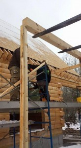 building shed porch on log home, outdoor living area, Timberhaven Log Homes, log homes, log cabin homes, log cabins, post and beam homes, timberframe homes, timber frame homes, laminated logs, engineered logs, floor plan designs, kiln dried logs, Flury Builders, Joe Walsh, Timberhaven local reps, log homes in Massachusetts, log homes in Rhode Island, MA, RI, log home builders